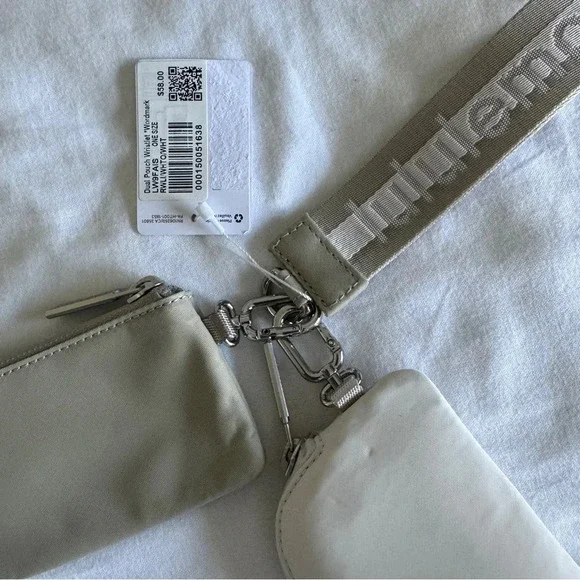 12 🆕 Lululemon Dual Pouch Wristlet Wordmark Raw Linen White Opal